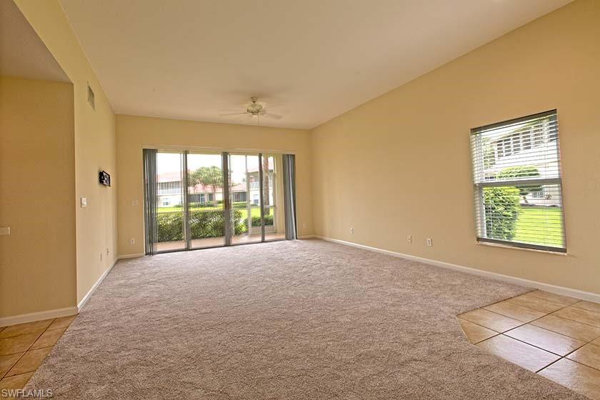 25064 Peacock Lane, Unit 102 Naples, FL 34114 - Photo 5 of 21 a view of an empty room with a window