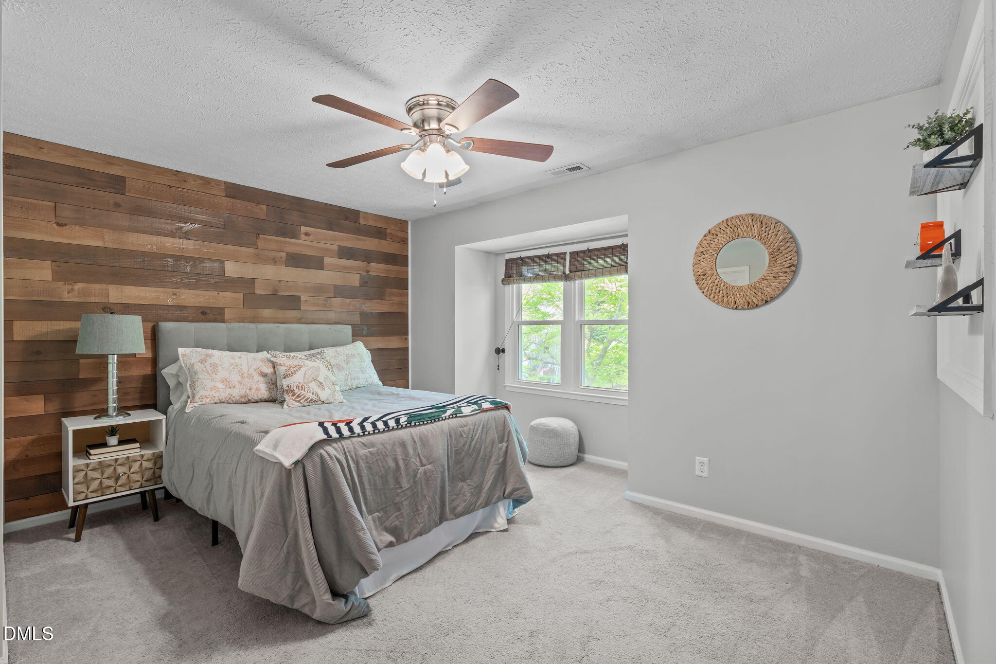203 Oak Hollow Court Raleigh, NC 27613 - Photo 20 of 37 a spacious bedroom with a bed and a chandelier