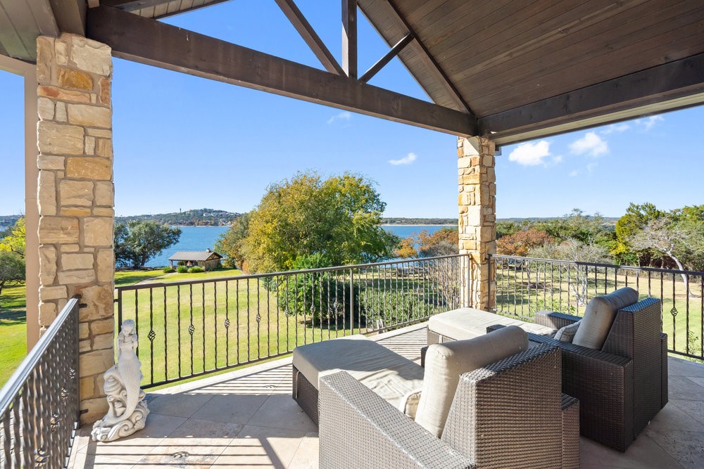 14423 Ridgetop Terrace Austin, TX 78732 - Photo 25 of 49 a view of a chair and tables in the balcony