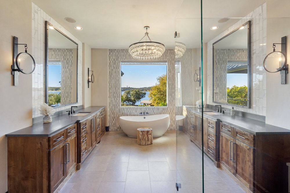 14423 Ridgetop Terrace Austin, TX 78732 - Photo 26 of 49 a spacious bathroom with a large tub sink and mirror