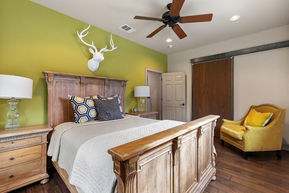 14423 Ridgetop Terrace Austin, TX 78732 - Photo 47 of 49 a bed room with a bed and a chair