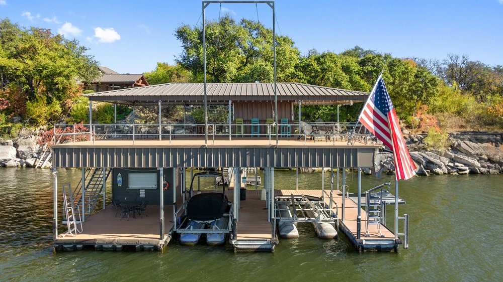 14423 Ridgetop Terrace Austin, TX 78732 - Photo 10 of 49 a view of a patio with a table and chairs