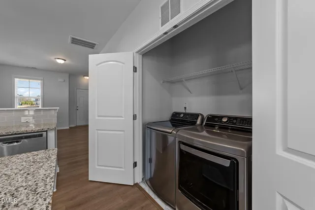 a kitchen with a stove and a refrigerator