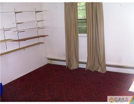 3 Ellmyer Road Edison, NJ 08820 - Photo 16 of 18 an empty room with wooden floor