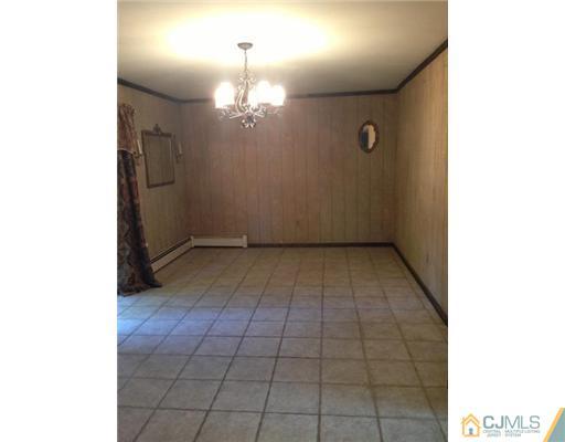 3 Ellmyer Road Edison, NJ 08820 - Photo 7 of 18 a view of an empty room with a window