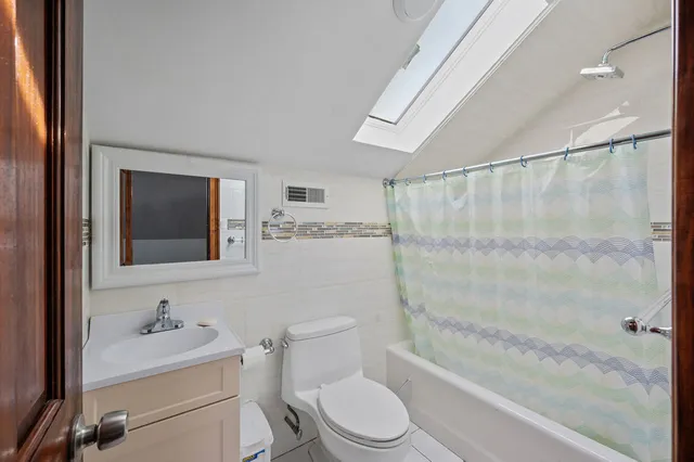 a bathroom with a toilet a sink and a bathtub