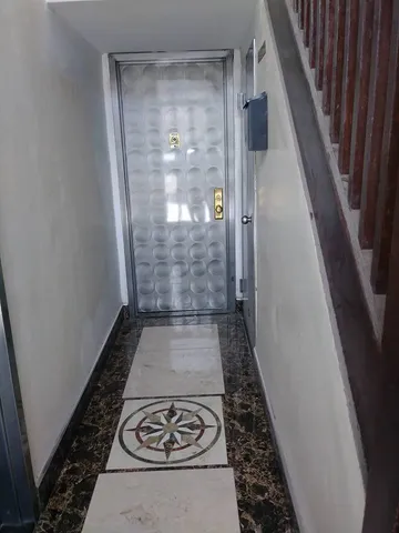 a bathroom with a granite countertop shower and a stove