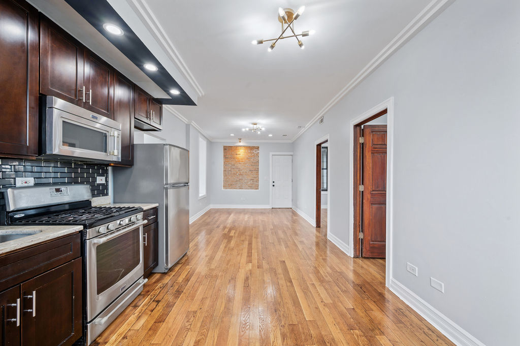 3100 West 39th Place Chicago, IL 60632 - Photo 8 of 36 a view of kitchen with sink and wooden floor