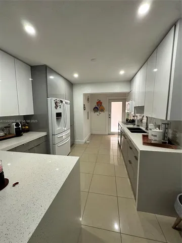 a living room with furniture a wooden floor and a window