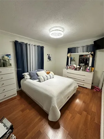 a bedroom with bed and window