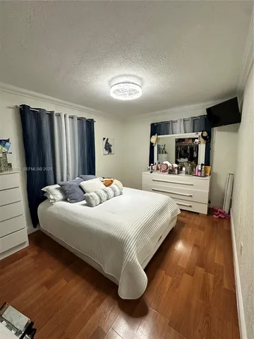 a bathroom with a granite countertop toilet and a shower curtain
