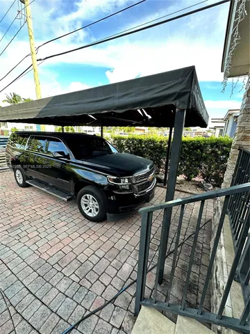 a view of a backyard with sitting area