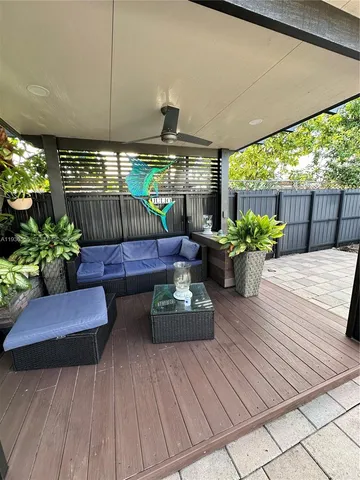 a view of a patio with a table and chairs