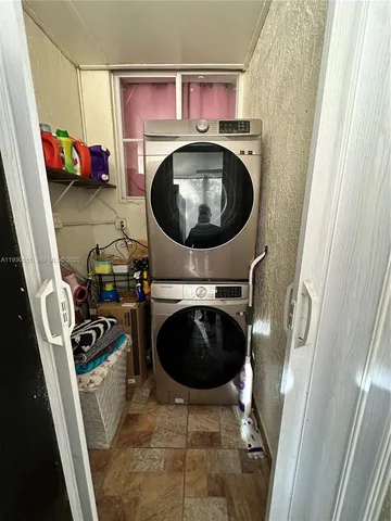 a kitchen with a sink appliances and cabinets