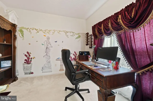 a view of workspace with furniture and a window