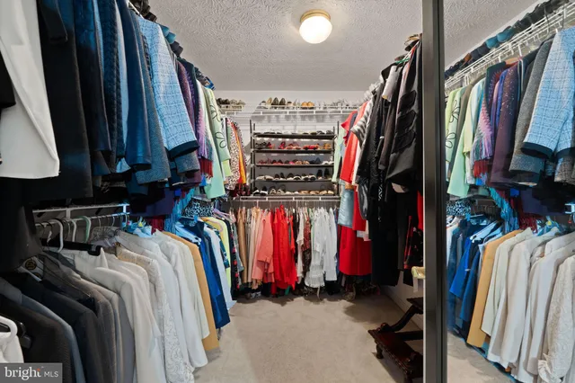 a bathroom with a tub sink and a large mirror