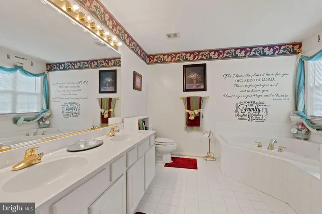 a bathroom with a tub shower and sink