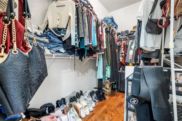 a bath room with a sink a vanity and a large mirror