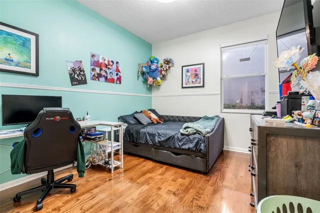 a bedroom with a workspace