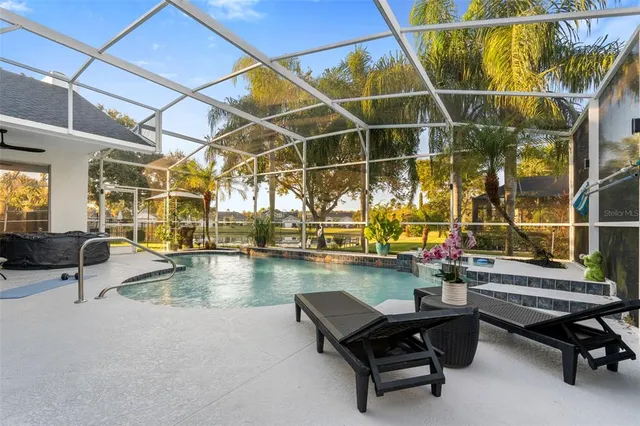 a view of a patio with table and chairs near floor