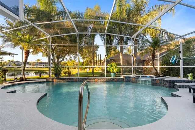a view of a swimming pool with outdoor seating