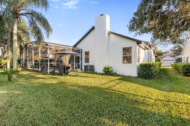 a view of swimming pool with outdoor seating and lake view