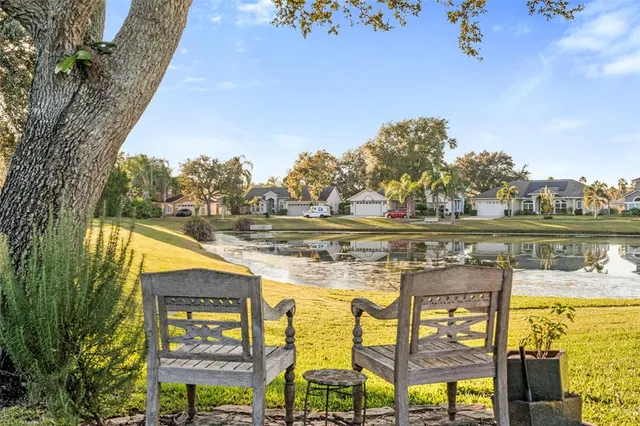 an aerial view of multiple houses with yard