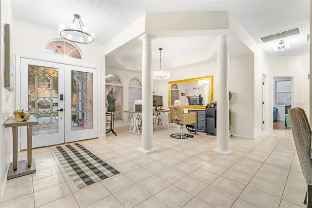 a view of a livingroom with furniture and a chandelier