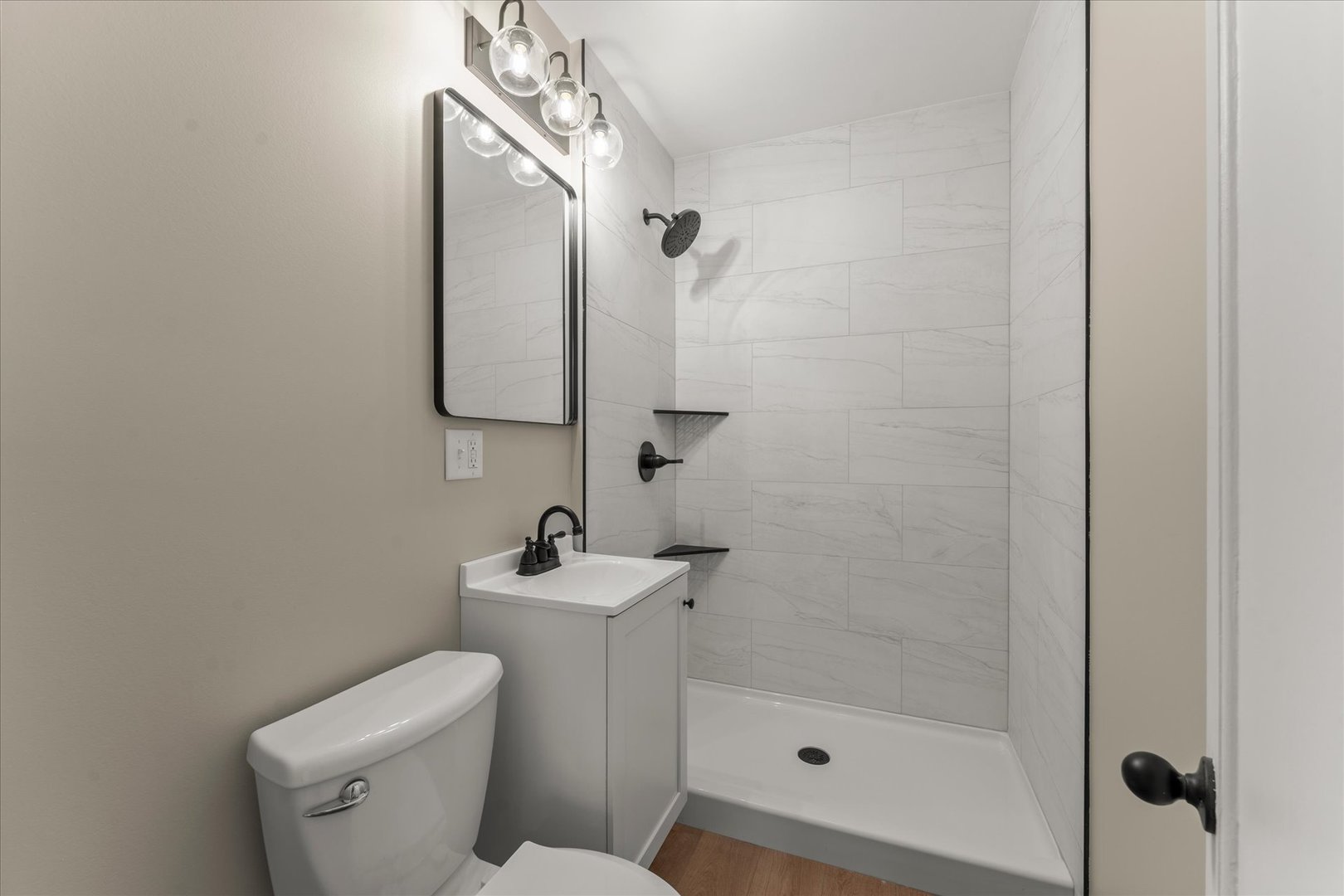 305 South Fair Street Champaign, IL 61821 - Photo 21 of 41 a bathroom with a toilet sink and shower