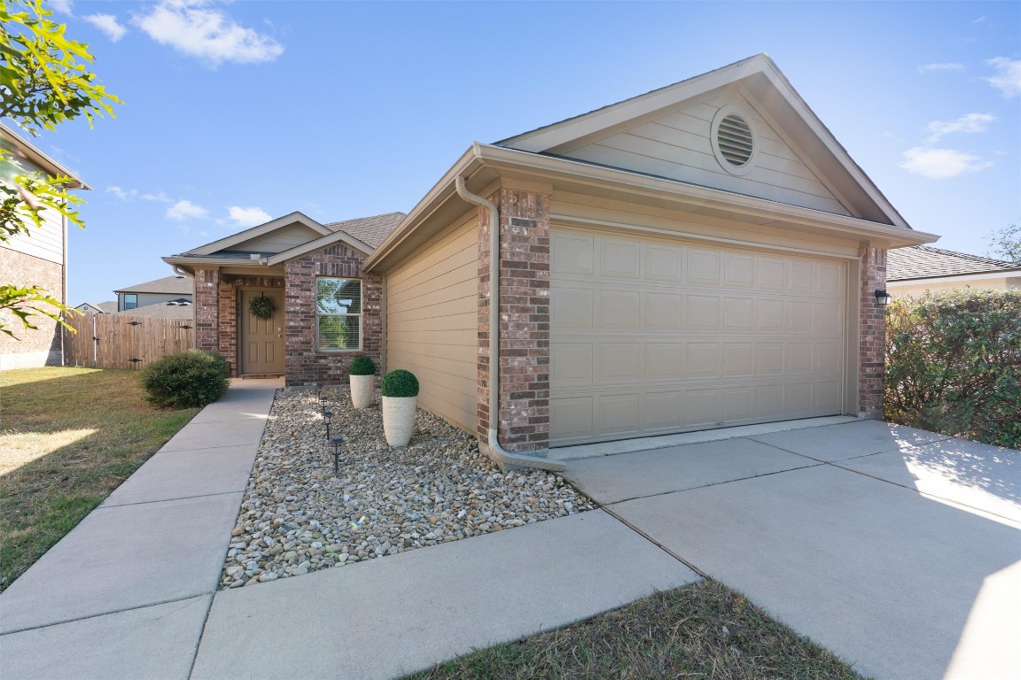 400 Pinnacle Drive Georgetown, TX 78626 - Photo 1 of 1 a front view of a house with garden