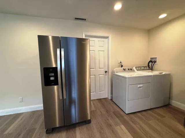 a utility room with washer and dryer