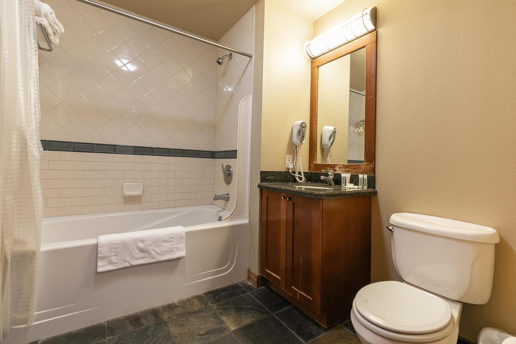 1850 Village South Road, Unit 4227 Olympic Valley, CA 96146 - Photo 13 of 21 a bathroom with a toilet a sink and bathtub