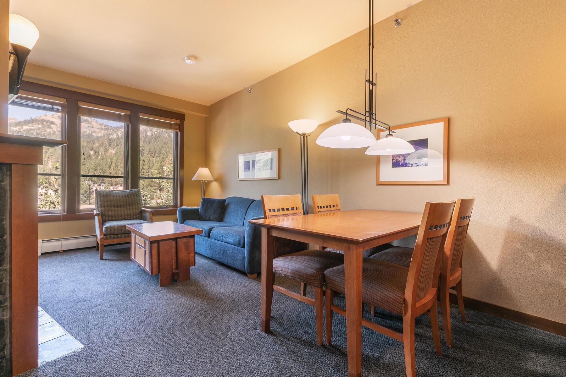 1850 Village South Road, Unit 4227 Olympic Valley, CA 96146 - Photo 8 of 21 a dining room with a wooden table and chairs