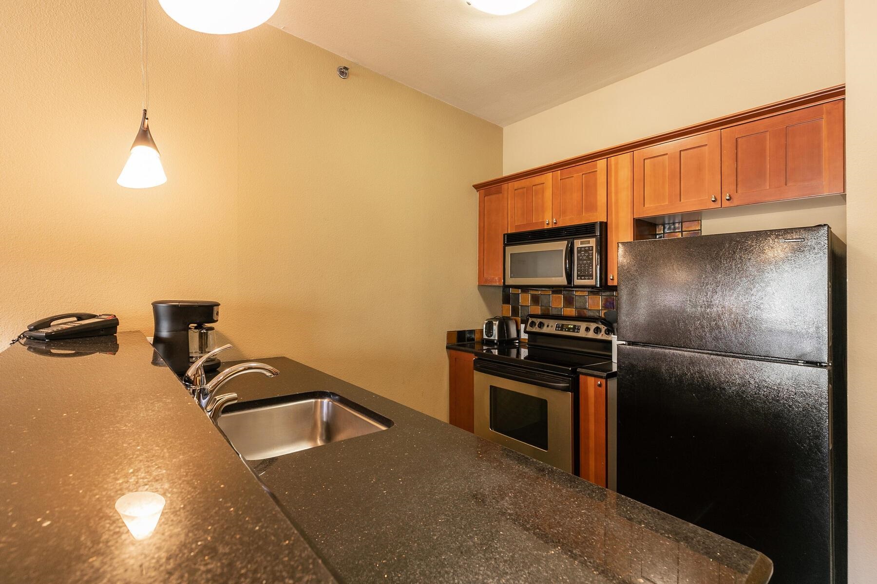 1850 Village South Road, Unit 4227 Olympic Valley, CA 96146 - Photo 10 of 21 a kitchen with a refrigerator and a sink