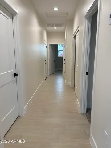 a view of a kitchen with a sink and window