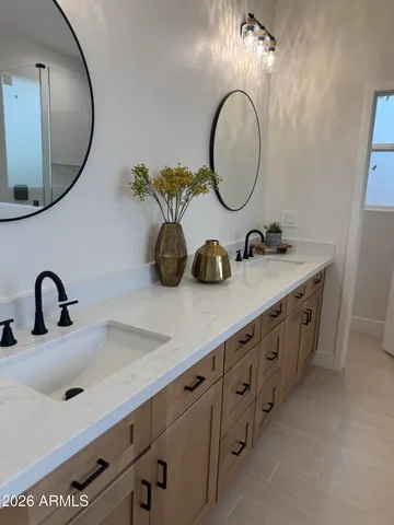 a bathroom with a glass shower door