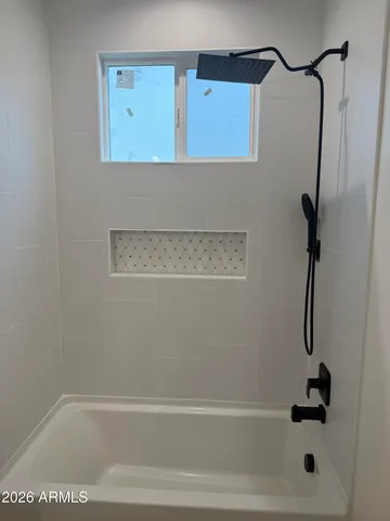 a bathroom with a sink and mirror