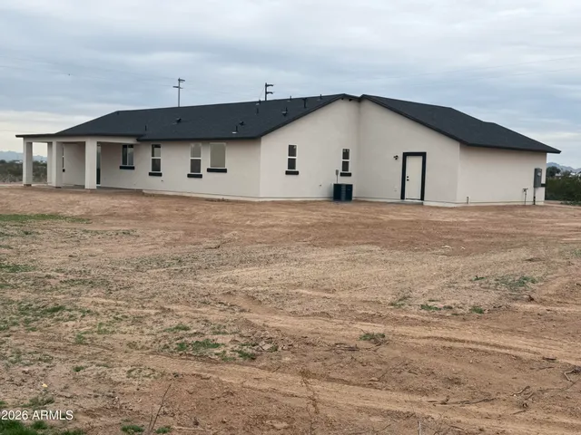 a view of a backyard of the house