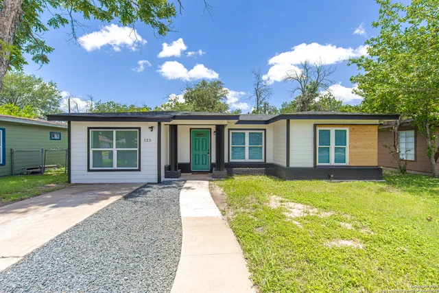 front view of a house with a yard