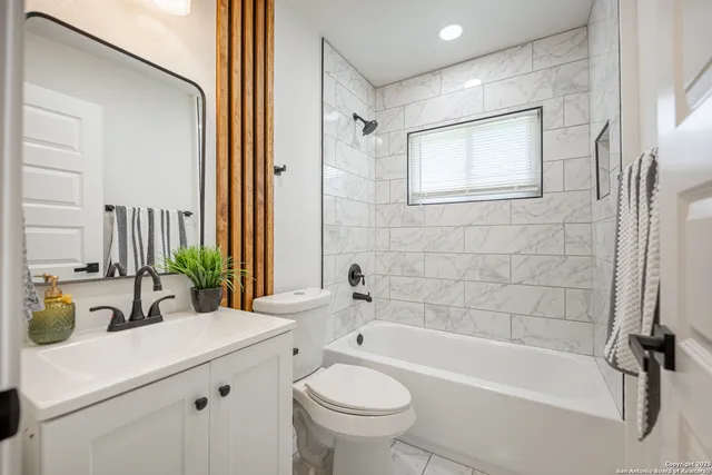 a bathroom with a sink a toilet and a bathtub