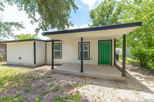 a backyard of a house with lots of green space