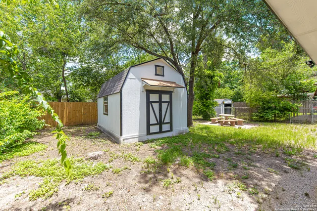a house with trees in the background