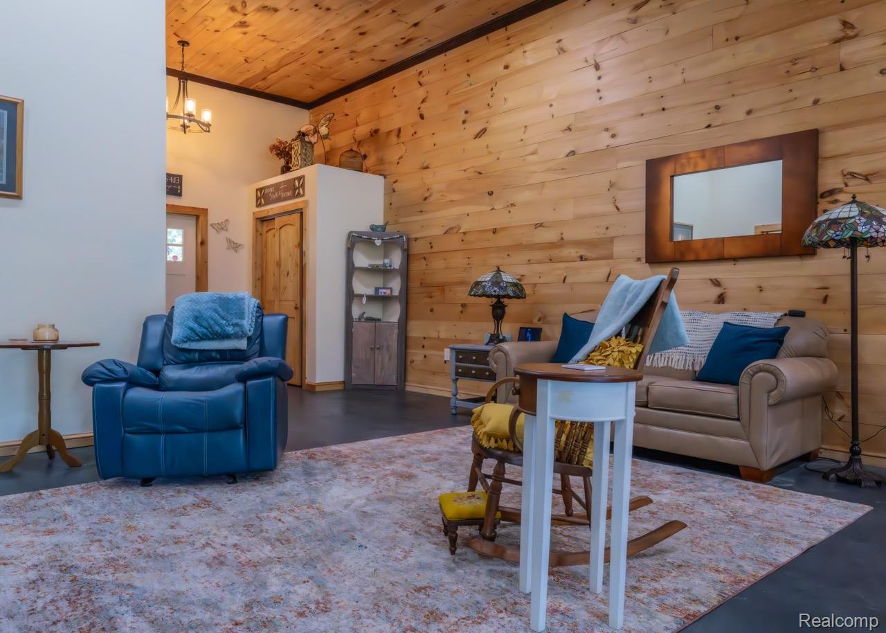 2418 South 41st Road South Cadillac, MI 49601 - Photo 7 of 57 Vaulted wood-paneled ceiling with exposed beams