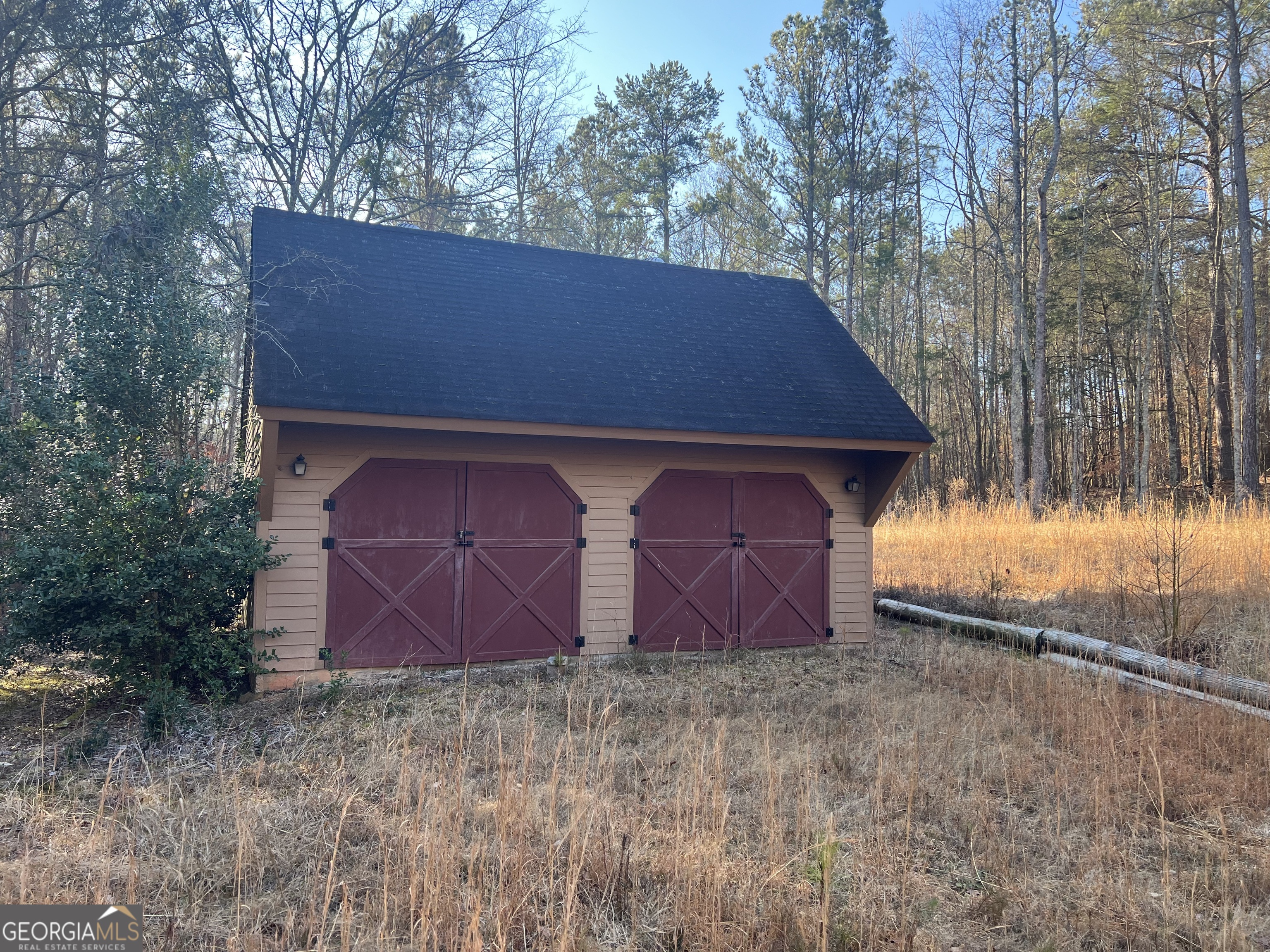 3140 Gees Mill Road Northeast Conyers, GA 30013 - Photo 11 of 17 a front view of house with yard and trees
