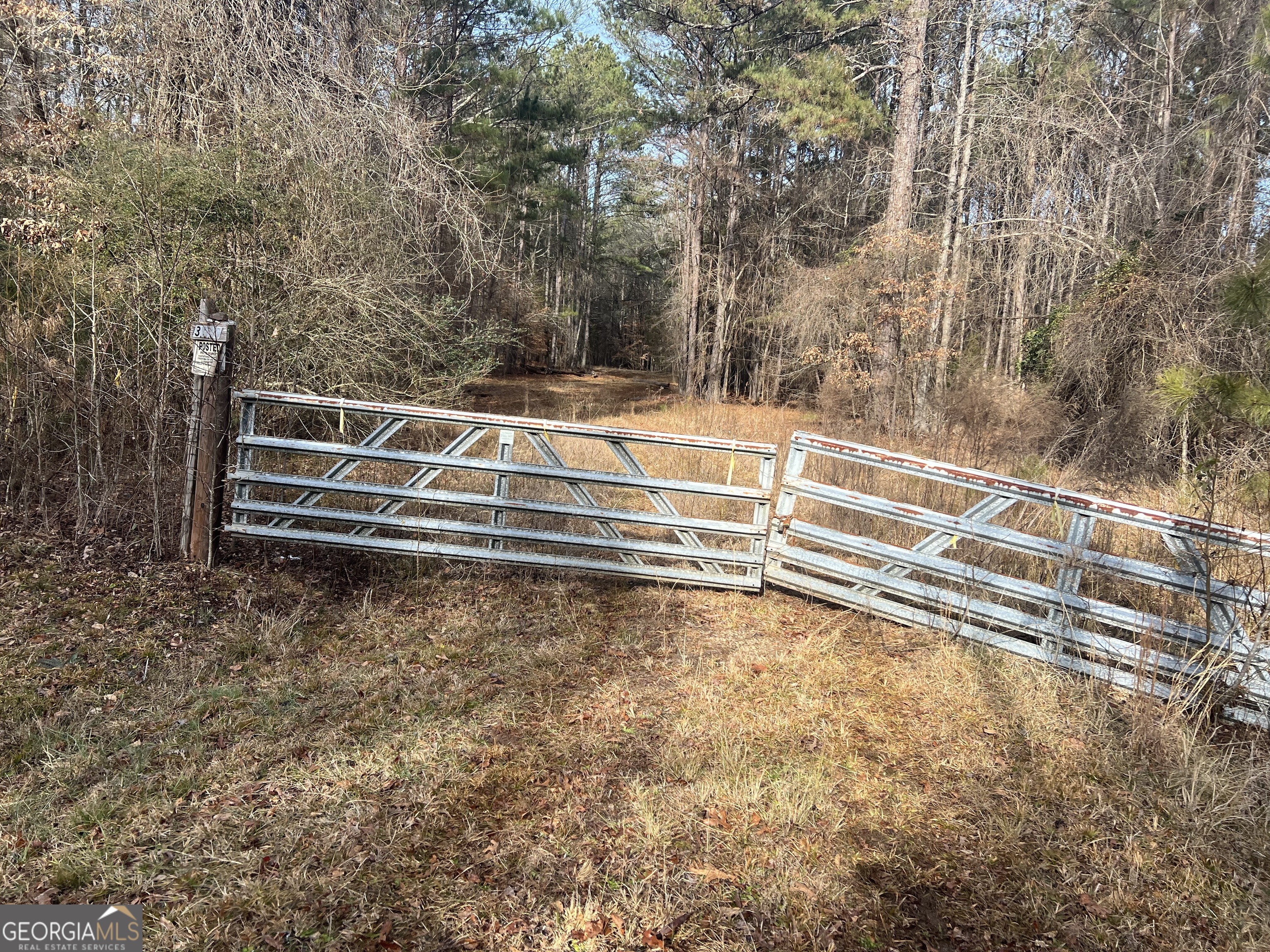 3140 Gees Mill Road Northeast Conyers, GA 30013 - Photo 9 of 17 a view of backyard with wooden fence and trees