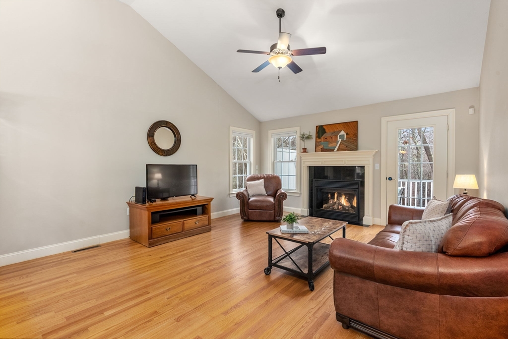 156 Canterbury Way, Unit 156 West Springfield, MA 01089 - Photo 13 of 32 a living room with furniture a fireplace and a window