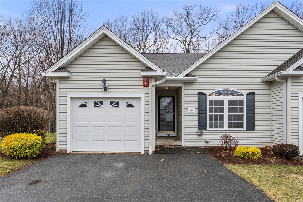 156 Canterbury Way, Unit 156 West Springfield, MA 01089 - Photo 2 of 32 a front view of a house with a garage