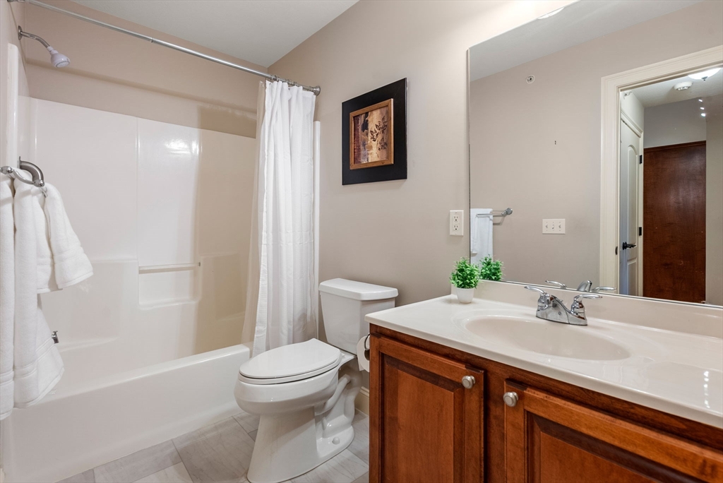 156 Canterbury Way, Unit 156 West Springfield, MA 01089 - Photo 23 of 32 a bathroom with a sink a toilet and shower