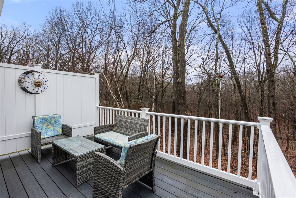 156 Canterbury Way, Unit 156 West Springfield, MA 01089 - Photo 29 of 32 a view of balcony with wooden floor and outdoor seating
