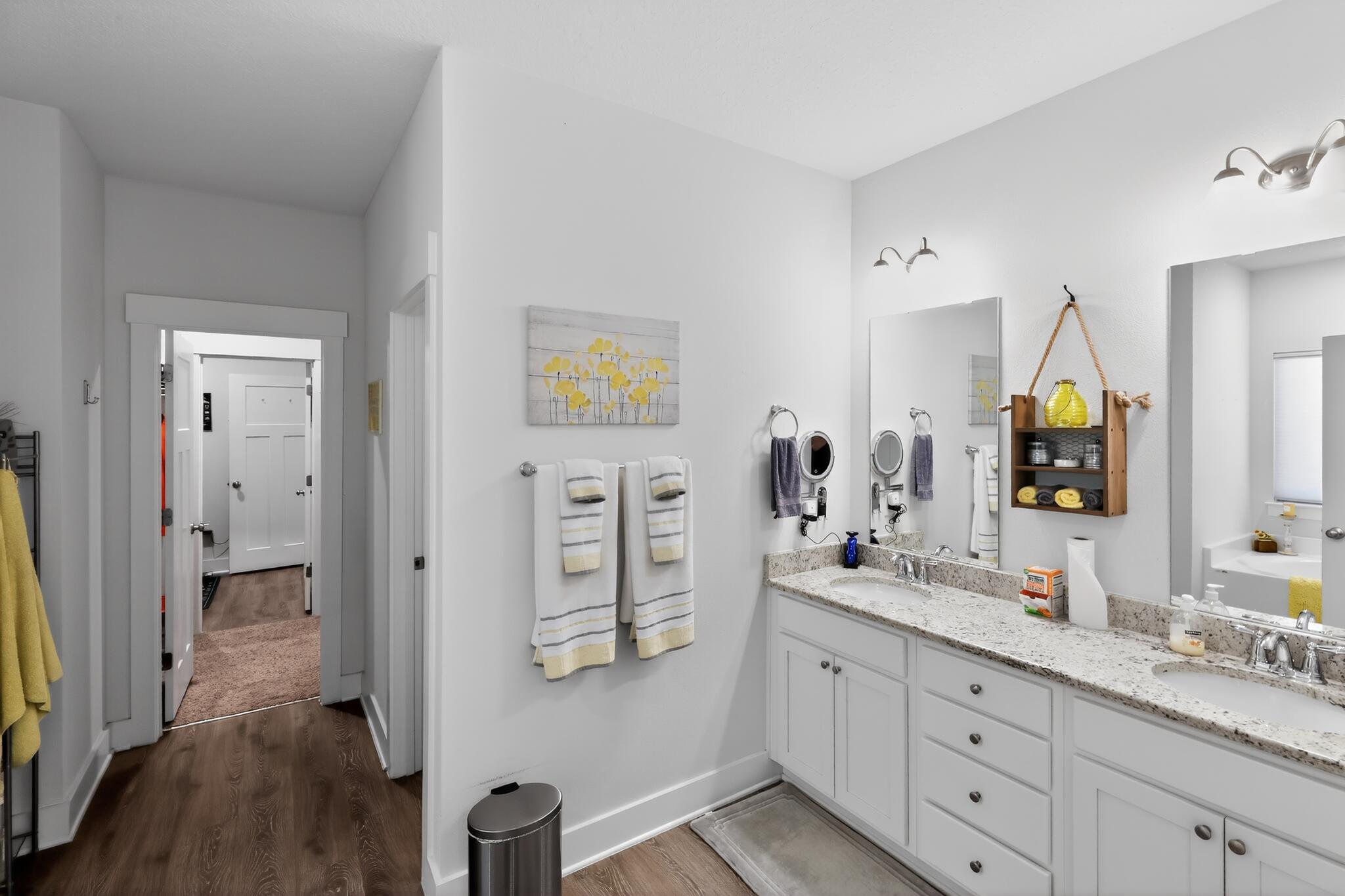 6070 Carina Road Crestview, FL 32539 - Photo 7 of 10 a spacious bathroom with a double vanity sink and a mirror